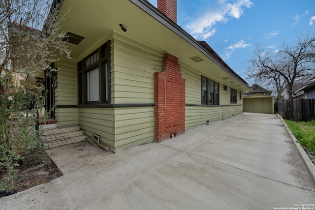 view of property exterior with a patio