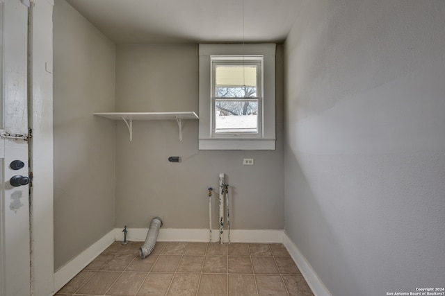 washroom featuring light tile floors