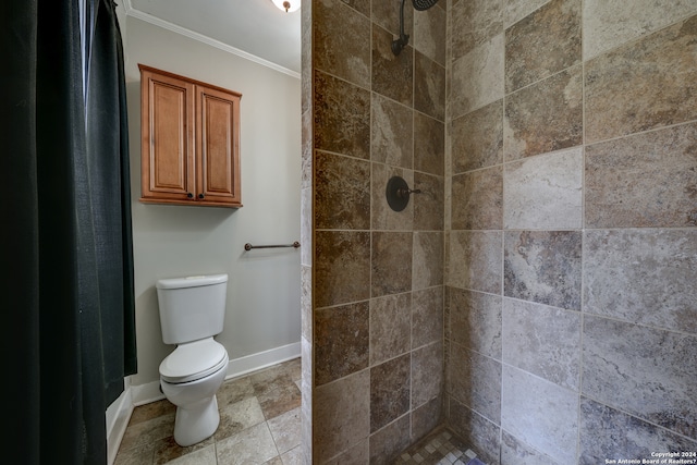 bathroom featuring ornamental molding, tile flooring, a tile shower, and toilet