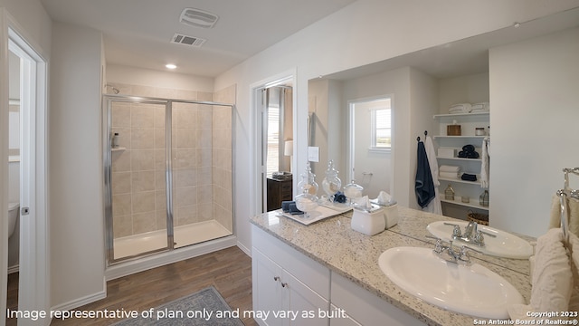 bathroom featuring vanity, hardwood / wood-style flooring, and walk in shower