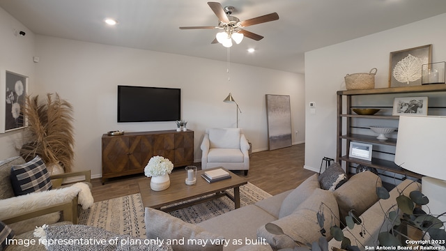 living room with hardwood / wood-style flooring and ceiling fan