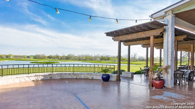 view of patio with a water view