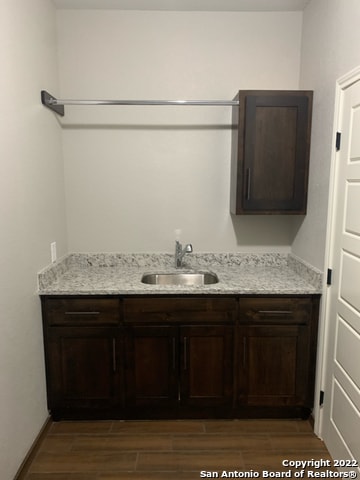 interior space featuring vanity and hardwood / wood-style flooring