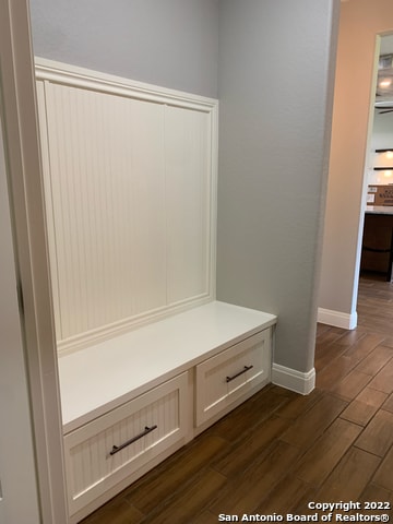 mudroom featuring dark wood-type flooring