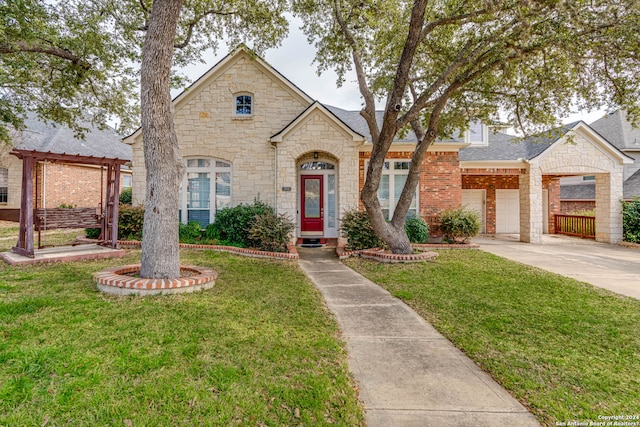 view of front facade featuring a front lawn and a garage