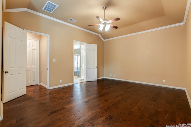 empty room with ceiling fan, lofted ceiling, dark wood-type flooring, and ornamental molding