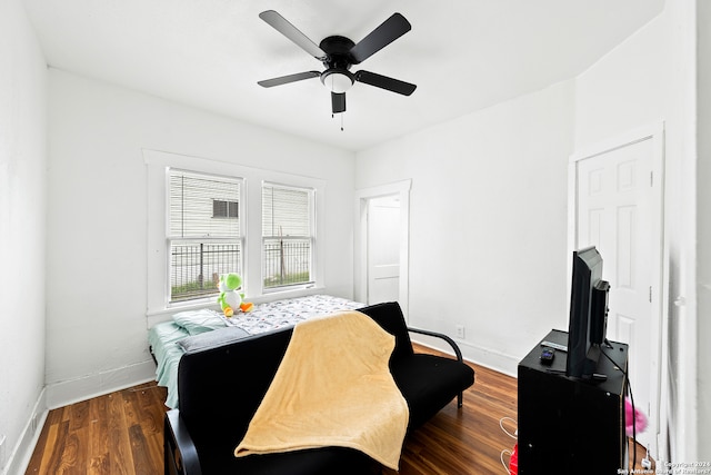 bedroom featuring ceiling fan and dark wood-type flooring