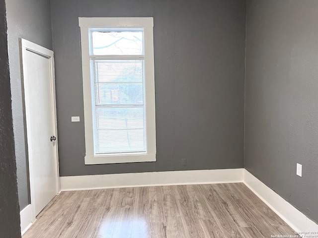 spare room with light wood-type flooring