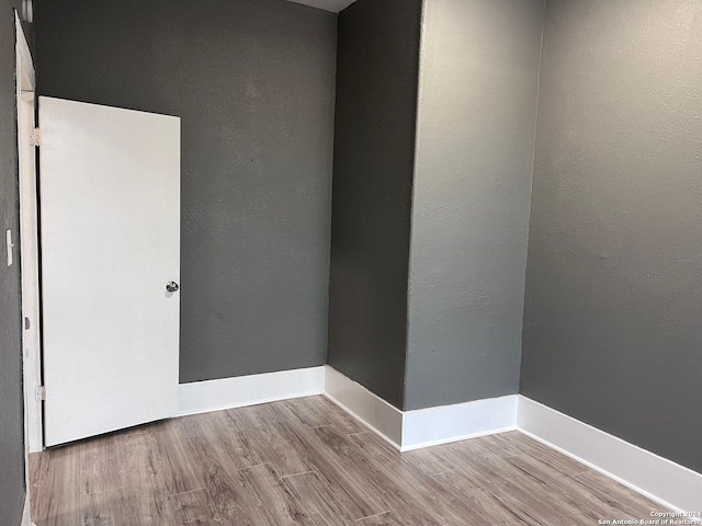 empty room featuring wood-type flooring