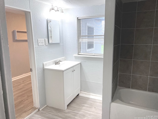 bathroom featuring hardwood / wood-style flooring and vanity