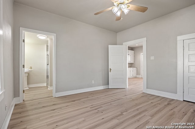 unfurnished bedroom with ceiling fan and light hardwood / wood-style floors