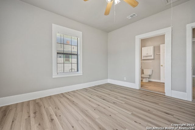 empty room with light hardwood / wood-style floors and ceiling fan