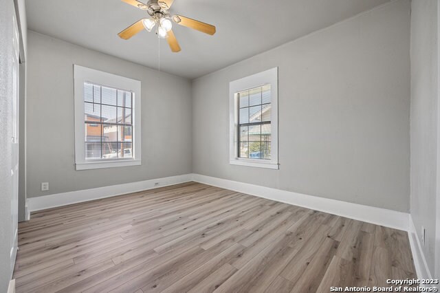 empty room featuring light hardwood / wood-style floors and ceiling fan