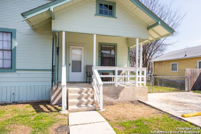 view of exterior entry featuring a porch