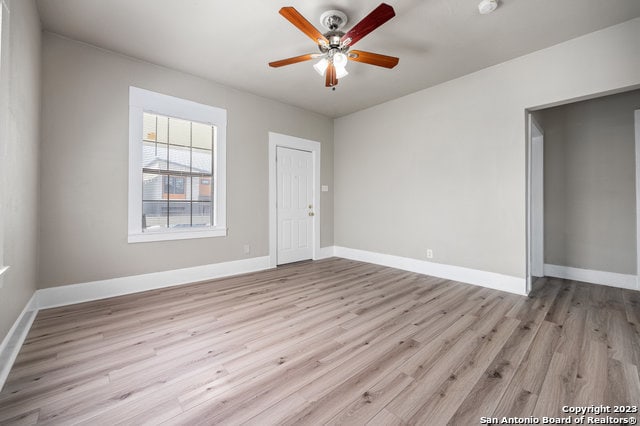 unfurnished room with light hardwood / wood-style flooring and ceiling fan