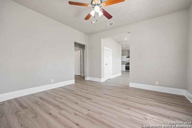 unfurnished room featuring light hardwood / wood-style floors and ceiling fan