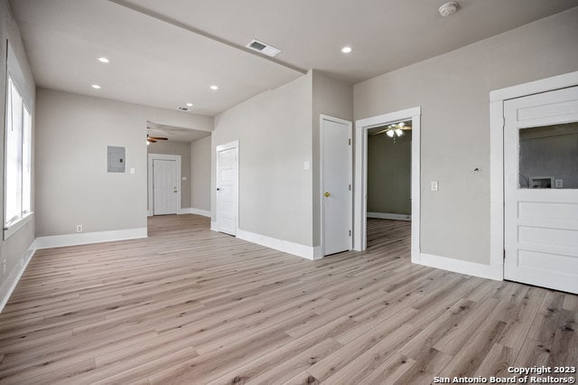 spare room with ceiling fan and light hardwood / wood-style floors