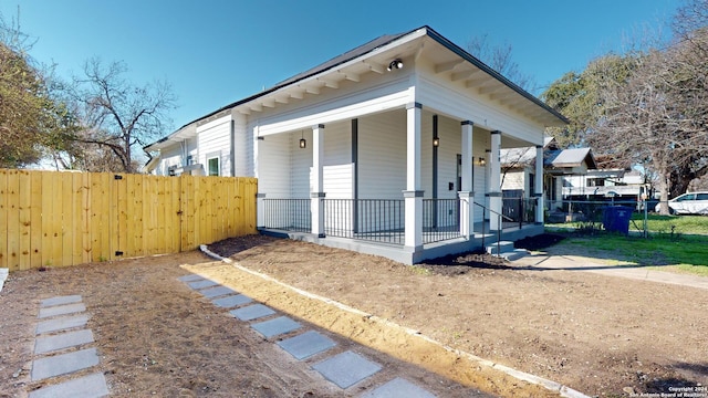 view of property exterior with covered porch