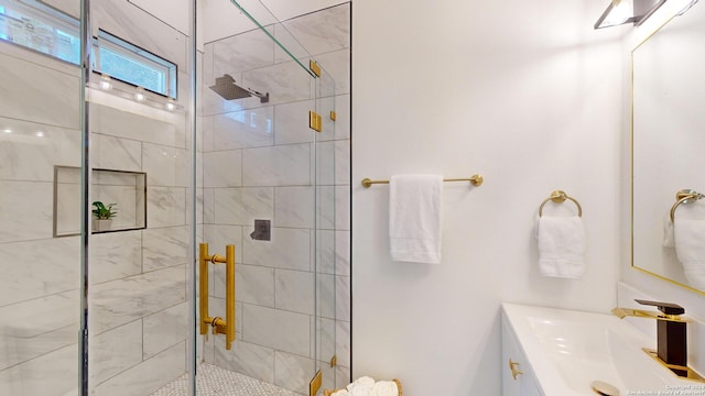 bathroom with walk in shower and large vanity