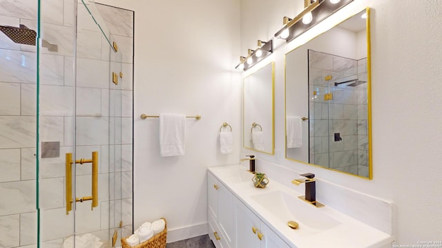 bathroom featuring oversized vanity, dual sinks, and walk in shower