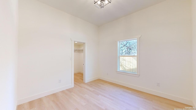 unfurnished room with light hardwood / wood-style floors