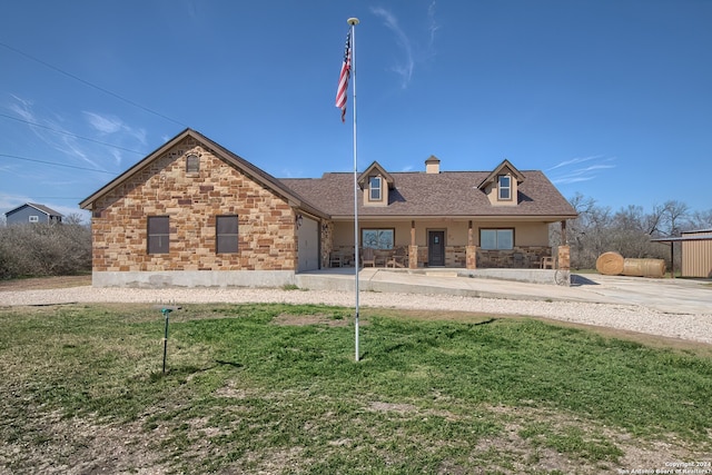 cape cod home with a front yard