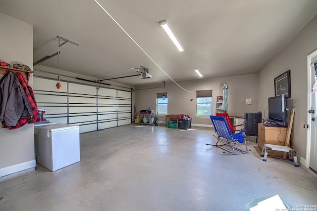 garage featuring a garage door opener