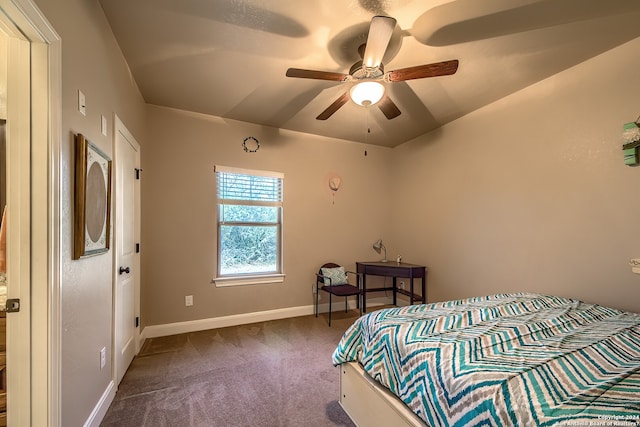 bedroom featuring ceiling fan and dark colored carpet