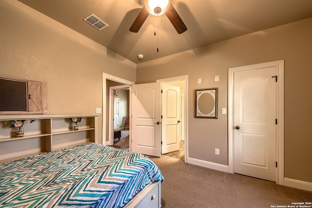 bedroom featuring light carpet, a closet, ceiling fan, and lofted ceiling