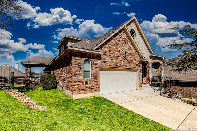 view of front facade featuring a front yard and a garage