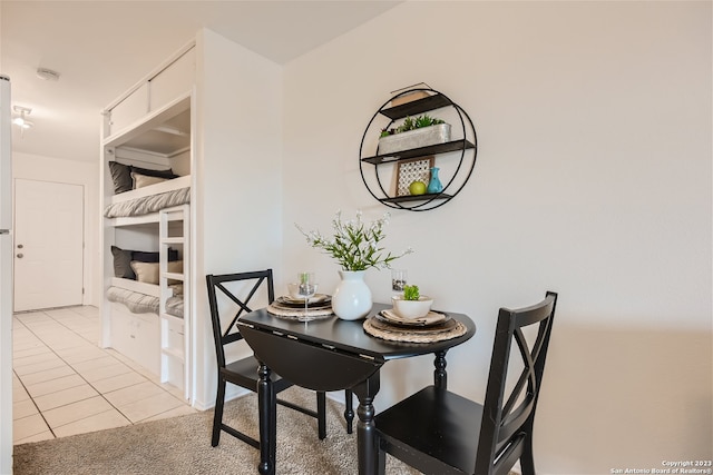 dining room featuring light tile floors