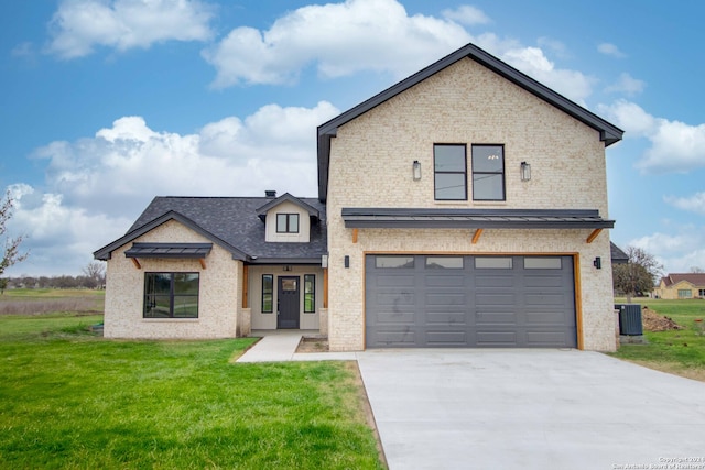 view of front of home featuring a front lawn and a garage