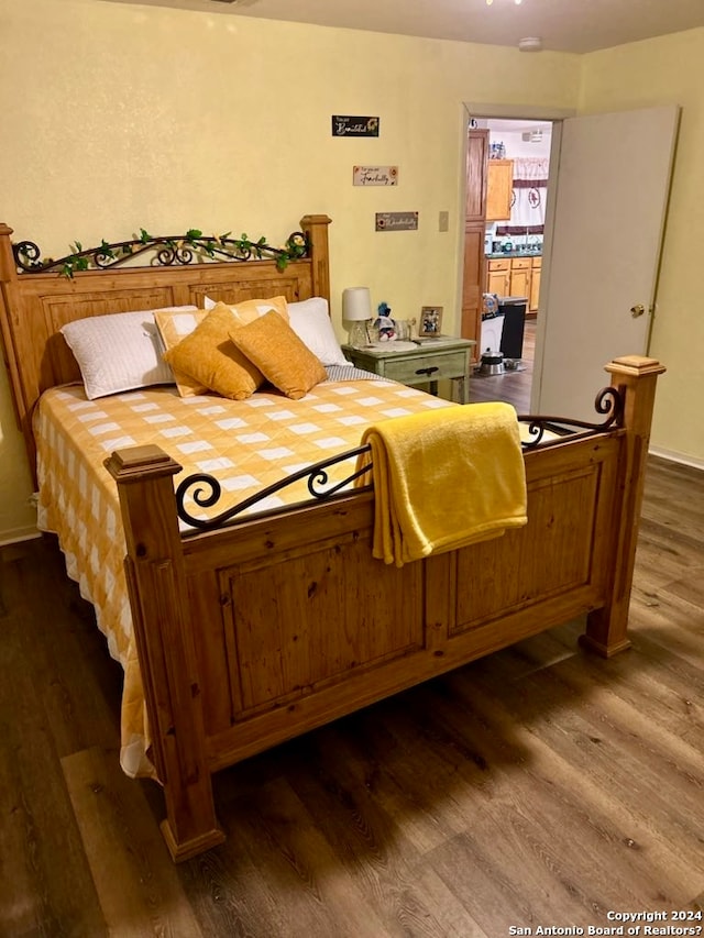 bedroom featuring dark hardwood / wood-style floors