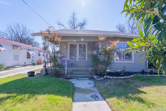 bungalow featuring a porch and a front yard