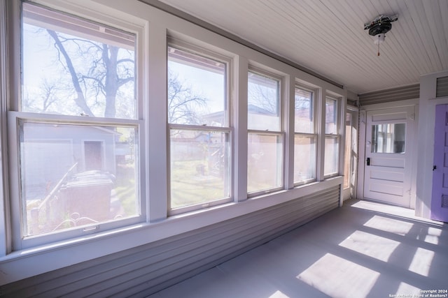 unfurnished sunroom with a healthy amount of sunlight