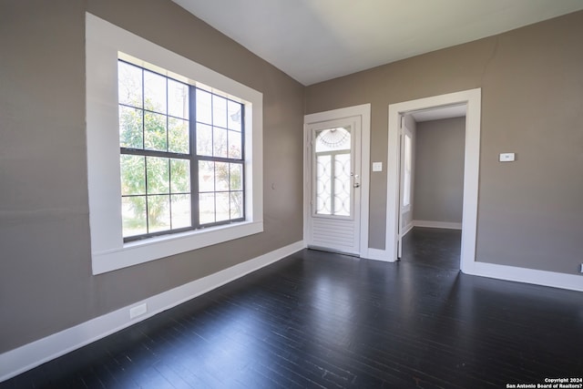 spare room featuring dark hardwood / wood-style flooring