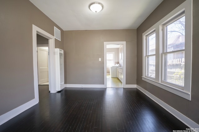 empty room featuring dark hardwood / wood-style floors