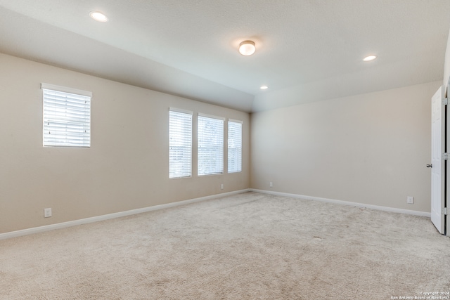 unfurnished room with recessed lighting, a healthy amount of sunlight, and baseboards