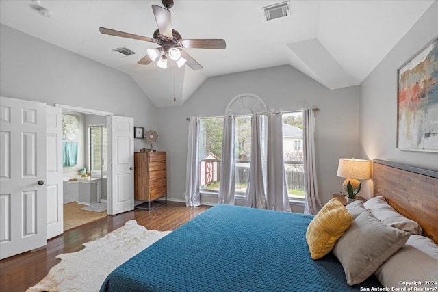 tiled bedroom featuring ceiling fan, lofted ceiling, and ensuite bathroom