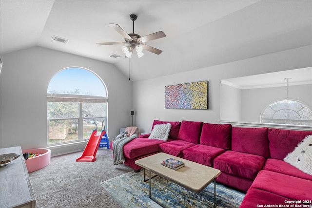 carpeted living room featuring ceiling fan and lofted ceiling