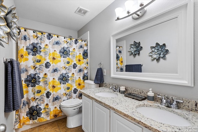 bathroom featuring a notable chandelier, toilet, tile floors, and dual vanity