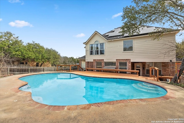 view of pool featuring a wooden deck