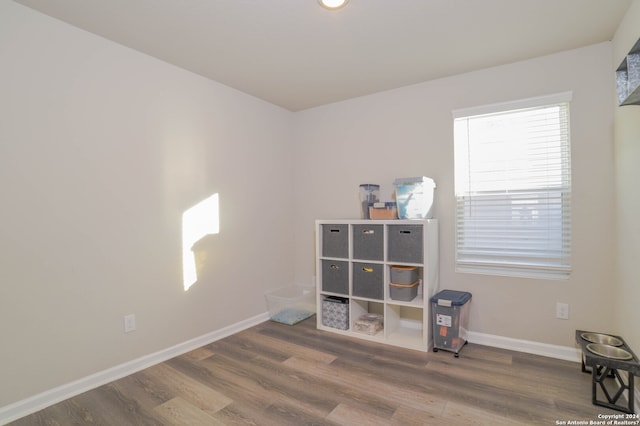 miscellaneous room with dark hardwood / wood-style flooring