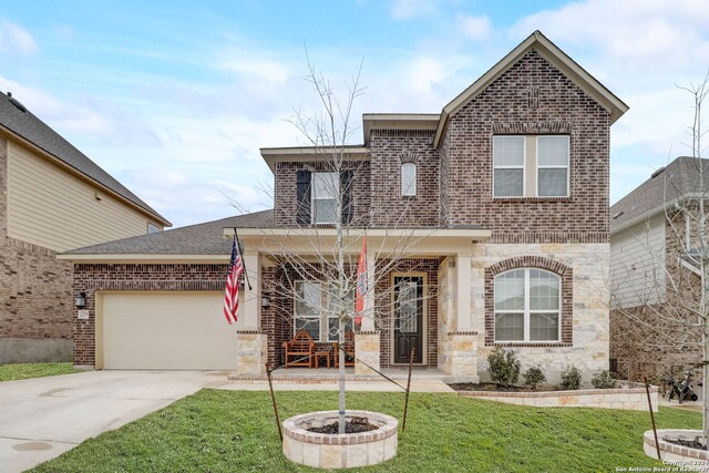 view of front of property with a front lawn and a garage