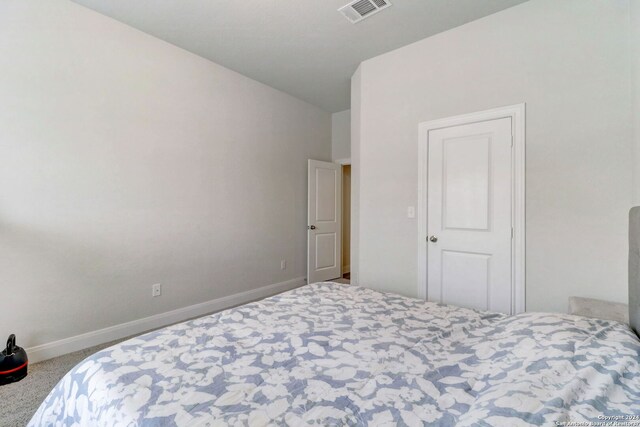 bedroom featuring carpet