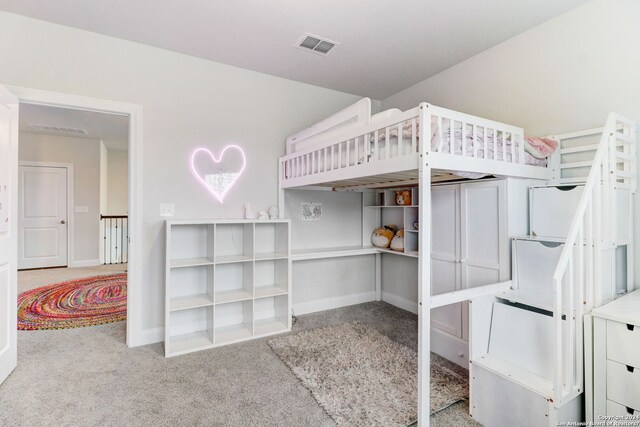 bedroom featuring light carpet