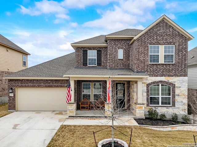 view of front of house featuring a front yard and a garage