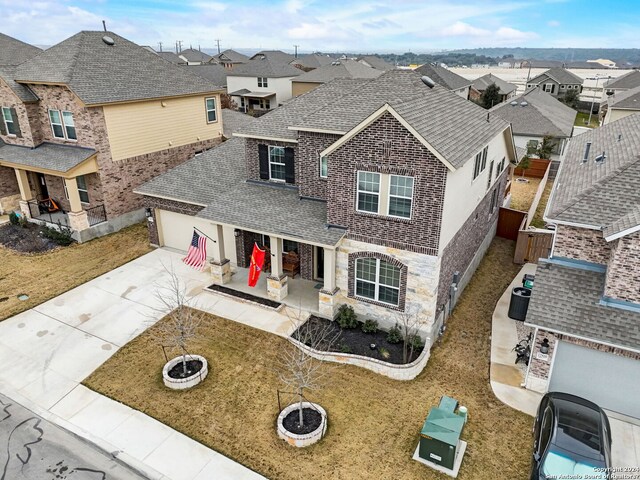 view of front facade featuring a patio area and a garage