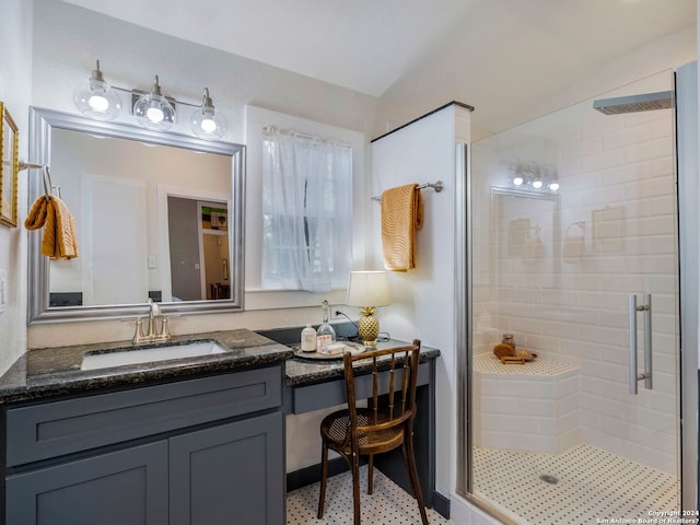 bathroom featuring vanity, a shower with door, and tile flooring