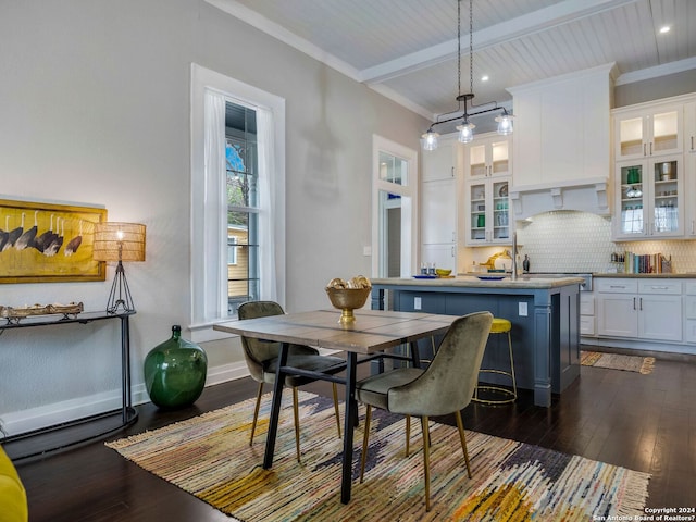 dining room featuring crown molding and dark hardwood / wood-style floors